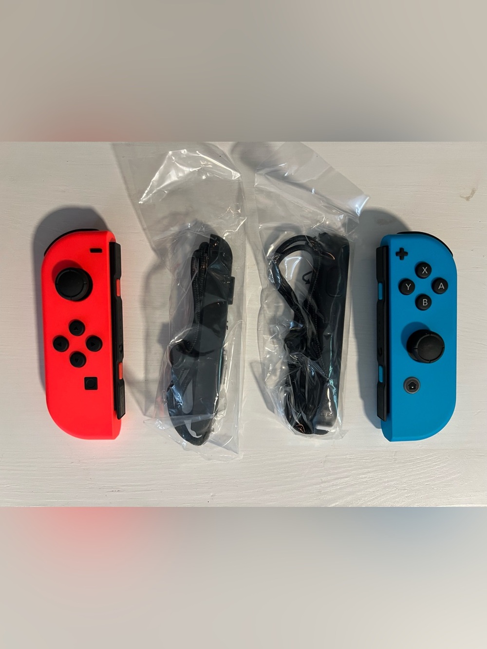 New in Box Nintendo Neon Red and Neon Blue Joy-Con Controller - Picture 2 of 2
